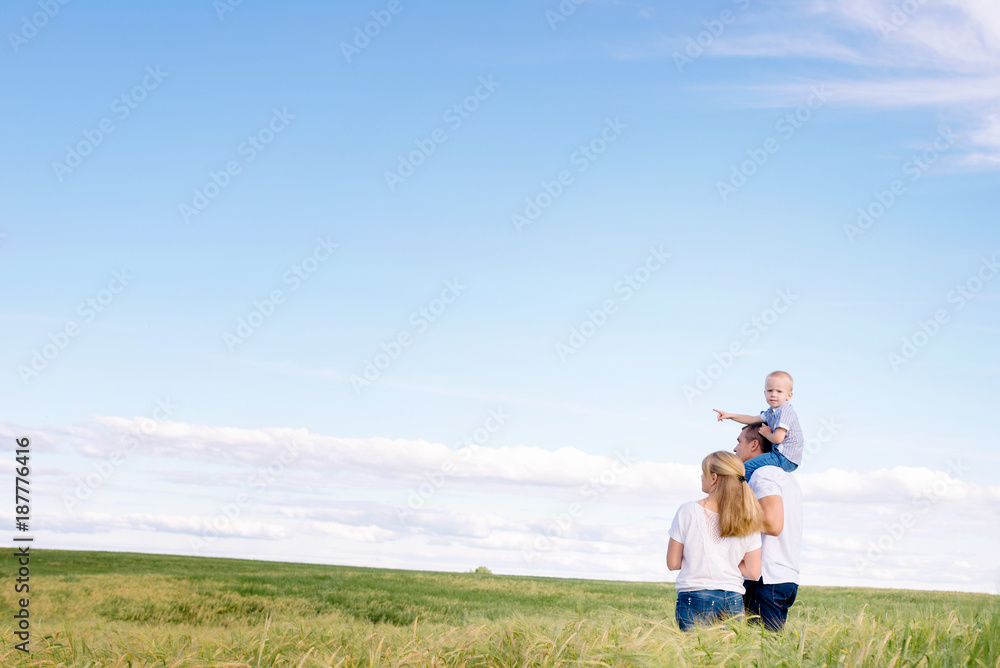 the happy family walks across the field the happy family walks across the field