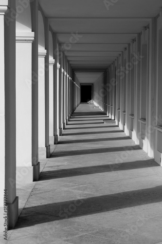 Black and white corridor archway perspective