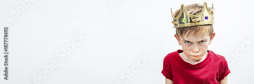 Tableau sur toile long banner of irritated beautiful spoiled boy with dirty look and golden crown