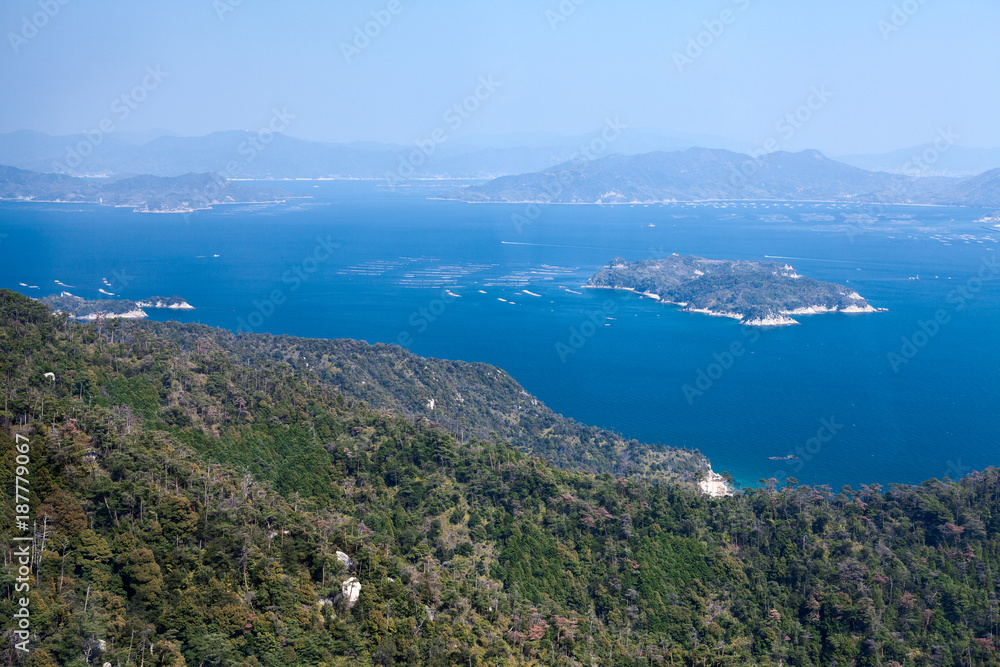 Fine clear day for looking at Shikoku Mountain Ranges and the dotted island of Seto Inland Sea. The Itsukushima (Miyajima) island, Japan