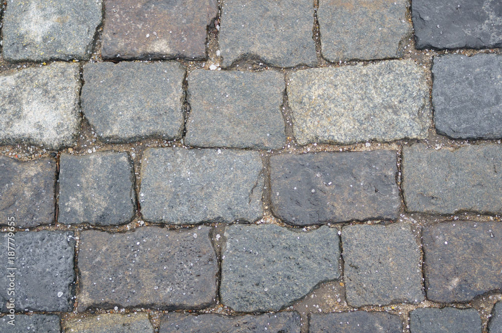 Stone pavement of dark stone, texture Stone pavement of dark stone, texture