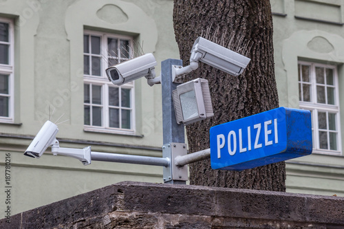 CCTV cameras on display next to a police station (with a police sign in German: Polizei) in the Bavarian city of Munich photo