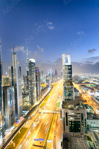 Photography Downrtown skyline along Sheikh Zayed Road at night, Dubai