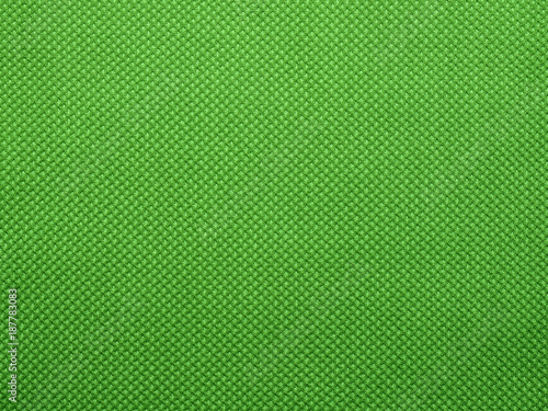 Perforated mesh fabric is green. Background.