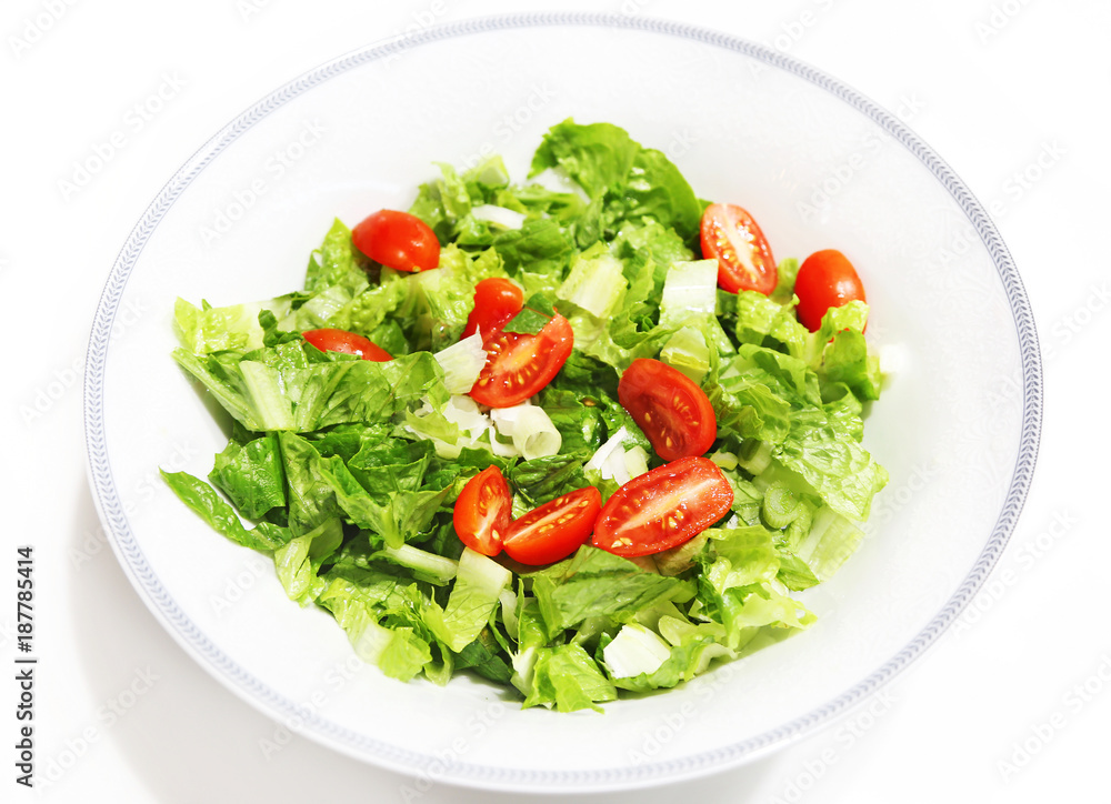 fresh salad with lettuce and tomatoes isolated on white fresh salad with lettuce and tomatoes isolated on white