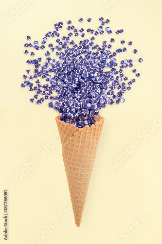 Ice cream cone with glitters. Minimal concept.