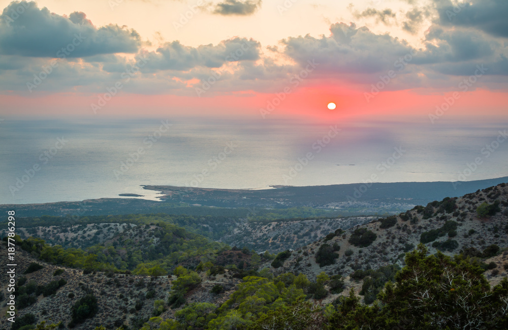 Sun setting behind Mediterranean sea at Akamas, Cyprus.