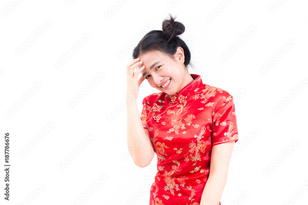 Portrait of a pensive asian woman wearing chinese dress cheongsam with standing and looking at camera. Chinese New Year Festivities, New Year Celebration. on white background. Portrait of a pensive asian woman wearing chinese dress cheongsam with standing and looking at camera. Chinese New Year Festivities, New Year Celebration. on white background.
