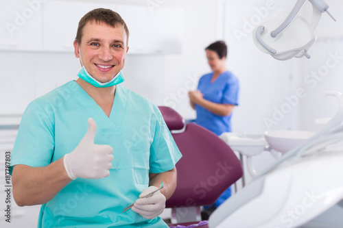 Adult doctor dentist in uniform