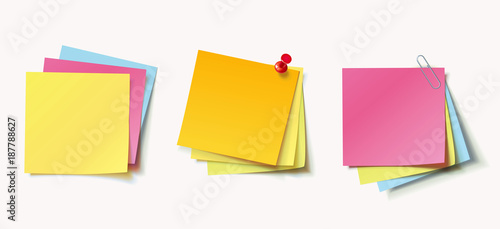 Stack of color stickers attached pushpin and paperclip