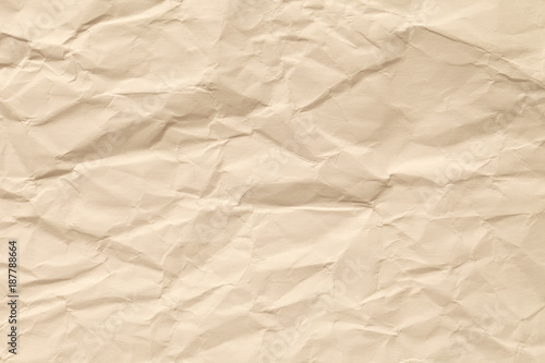 Paper of a beige color. The texture of the old surface is light brown.