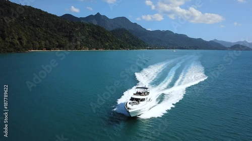 luxury boat aerial view, luxurious yacht moving fast in blue sea
