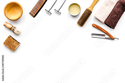 Tools beard and moustaches' care. Razor and brush on white background top view copy space