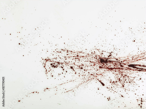 Spatter of red fluid on white background  photo