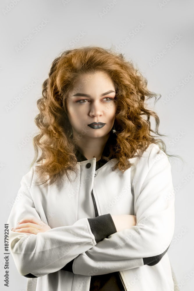 Charming beautiful tan skin caucasian woman serious angry face looking with dramatic feeling crossing her hands. Presenting your product. Charming beautiful tan skin caucasian woman serious angry face looking with dramatic feeling crossing her hands. Presenting your product.