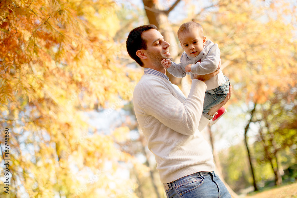 Young father and baby boy in autumn park Young father and baby boy in autumn park