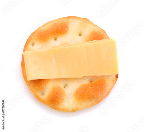 Whole wheat cracker and cheese, isolated on white background, close-up.