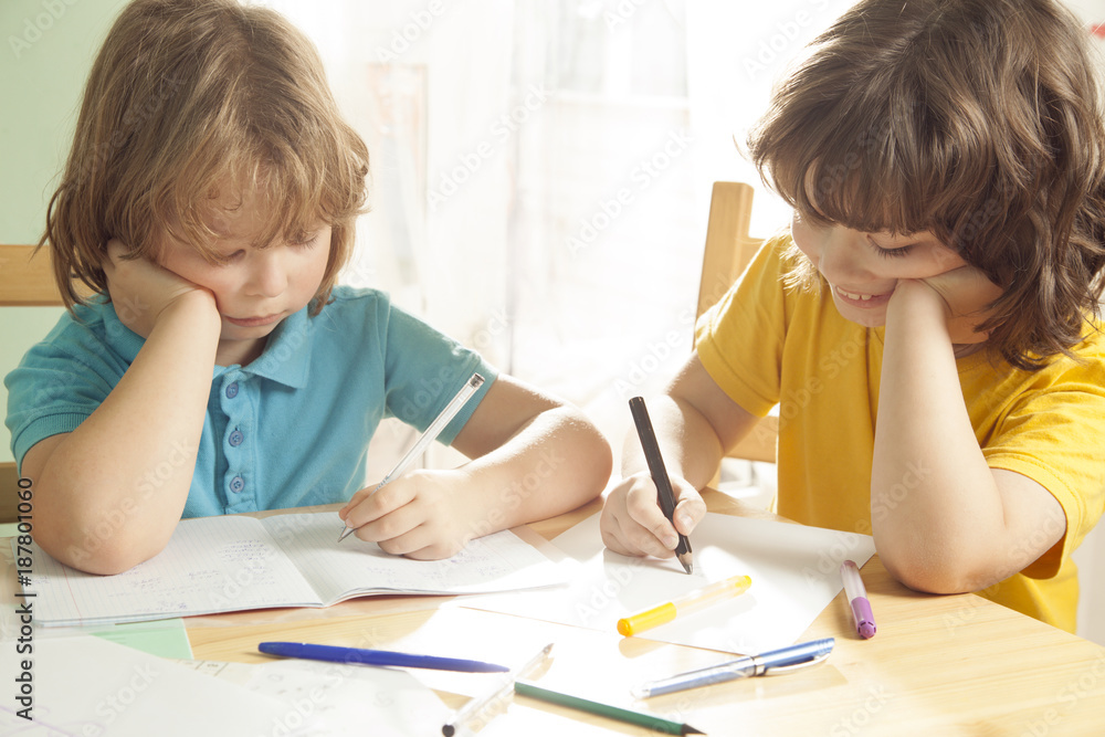 Two boy is doing his homework for elementary school Two boy is doing his homework for elementary school