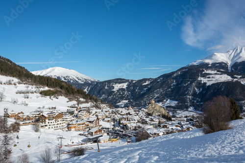 View on the small village Ladis in ski resort Serfaus Fiss Ladis in Austria with snowy mountains