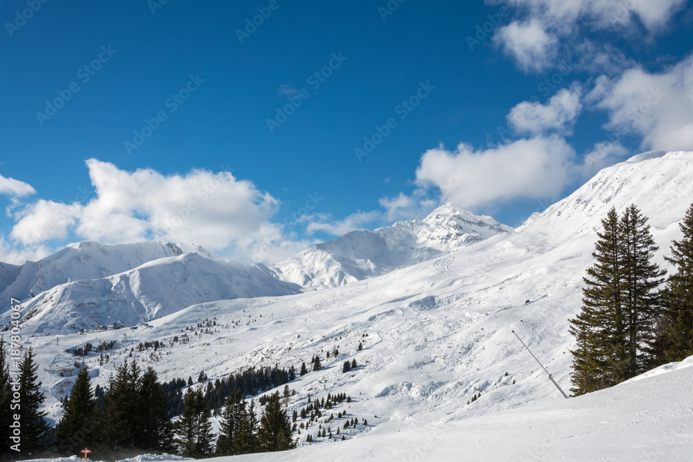 Slope in ski resort Serfaus Fiss Ladis in Austria with snowy mountains