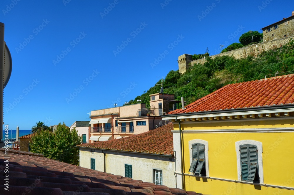 Castiglione della Pescaia, Tuscany, Italy 18 August 2014, 5.00 pm. View from below, towards the top where the hill of the village and the castle stands out.