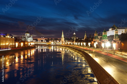 Moscow Kremlin on a winter evening. The view from the Moskvoretsky bridge on the Moscow River and the Kremlin embankment, Russia