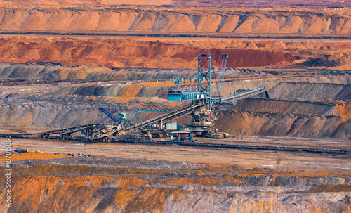 Canvas Print coal mine, opencast mining and blue mining machinery