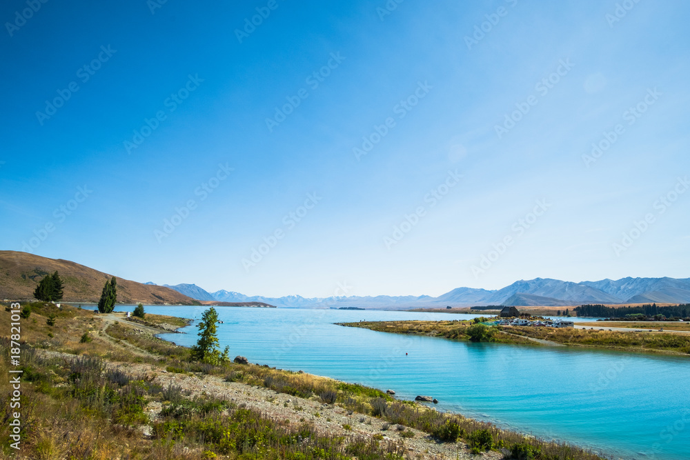 Panorama view of Beautiful scene of Mt Cook and Church of the Good Shepherd beside lake Tekapo with blue sky in summer. New Zealand