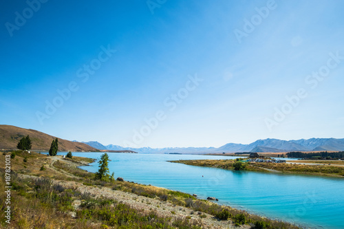 Panorama view of Beautiful scene of Mt Cook and Church of the Good Shepherd beside lake Tekapo with blue sky in summer. New Zealand