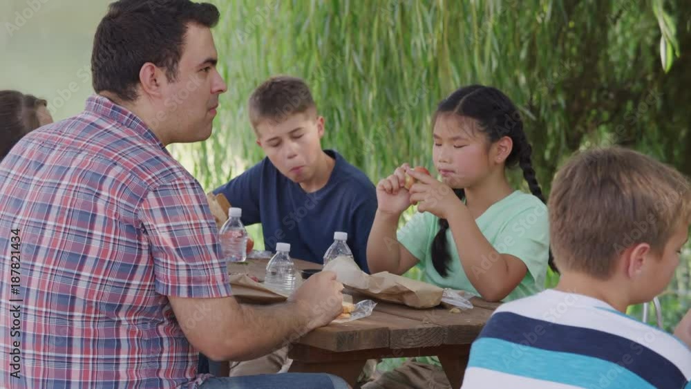 Kids at outdoor school having lunch together Kids at outdoor school having lunch together