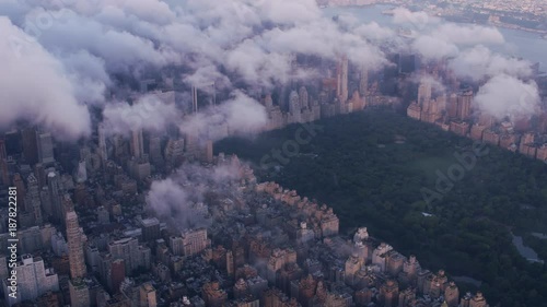 New York City circa-2017, Aerial view of Central Park and Manhattan through clouds.  Shot with Cineflex and RED Epic-W Helium. 