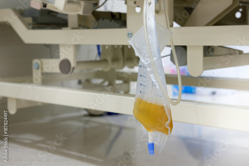 Urine or pee catheter bag hang under patient bed in hospital