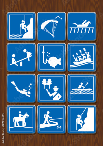 Set icons paragliding, diving, hippodrome, playground, horseback riding, rafting, hiking. Icons in blue color on wooden background. Vector image