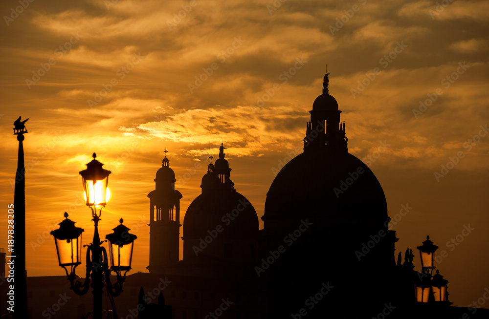 Venice sunset with domes and lamps