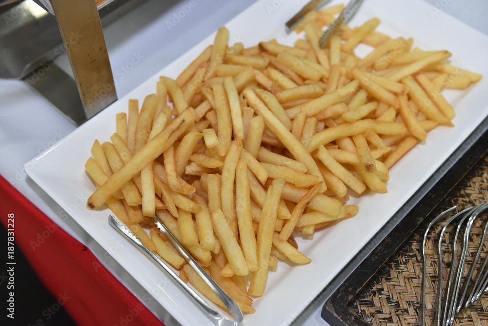 food, catering, self-service and eating concept - close up of french fries food, catering, self-service and eating concept - close up of french fries