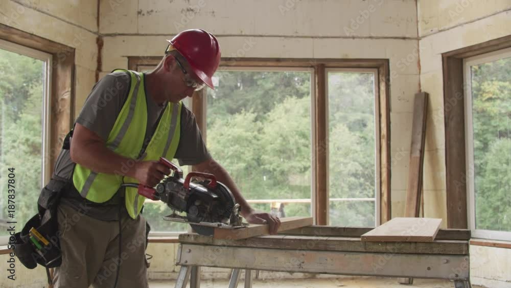 Construction worker cutting board with circular saw