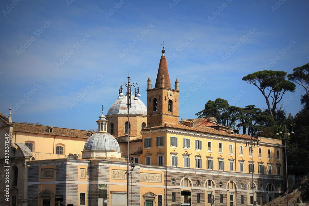 The Basilica of Santa Maria del Popolo in Rome, Italy. It stands on the north side of Piazza del Popolo, one of the most famous squares in the city