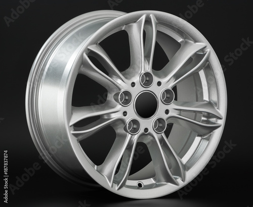 Aluminum metal wheel rim texture. Car alloy wheel, isolated on black background