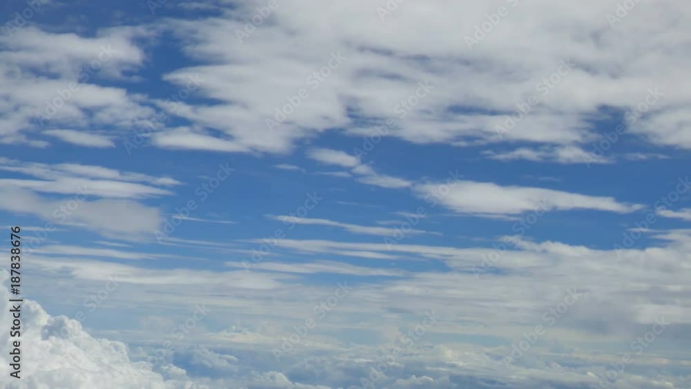view from aircraft window with blue sky and clouds view from aircraft window with blue sky and clouds
