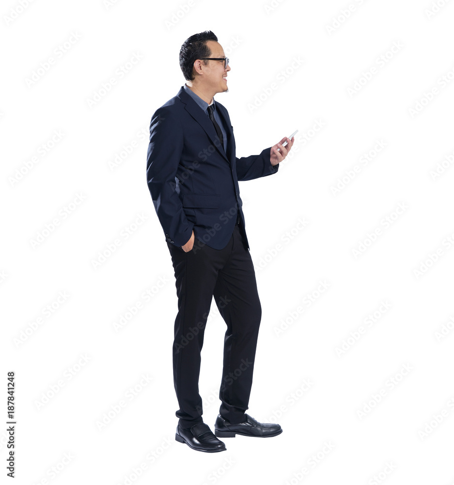 Full length portrait of smile asian businessman holding handphone . Isolated on white background . Full length portrait of smile asian businessman holding handphone . Isolated on white background .