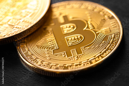golden bitcoin on wood background