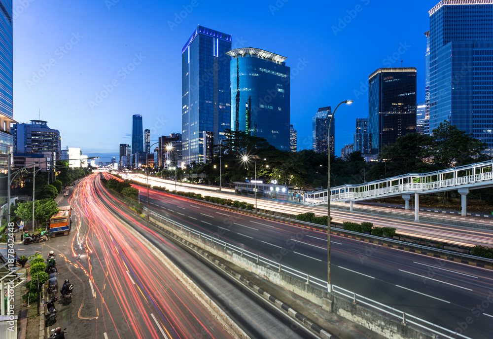 Traffic light trails in Jakarta business district in Indonesia capital city.