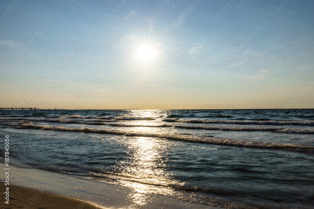 sunset over sea seen from the beach sunset over sea seen from the beach