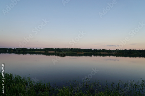 sunset over a lake in forest