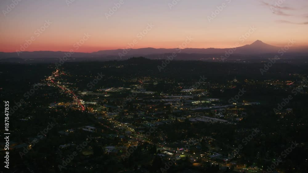 Portland, Oregon circa-2017, Flying over Portland suburb at night with Mt. Hood in background. Shot with Cineflex and RED Epic-W Helium. Portland, Oregon circa-2017, Flying over Portland suburb at night with Mt. Hood in background. Shot with Cineflex and RED Epic-W Helium.