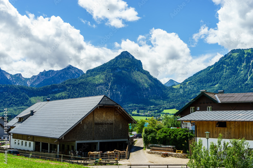 View on austrian alps and traditional buildings
