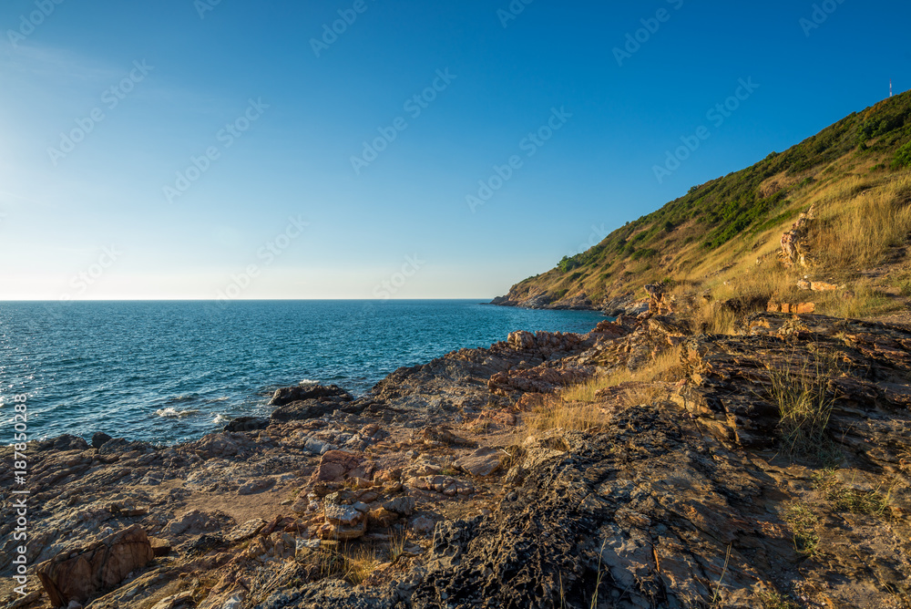 Grass Field on the mountain in front of the sea with soft sunlight, Khao Leam Ya National Park at Rayong of Thailand