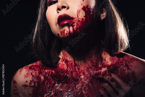 girl in blood makeup on sark background