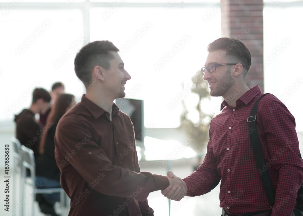 handshake colleagues in the office. handshake colleagues in the office.