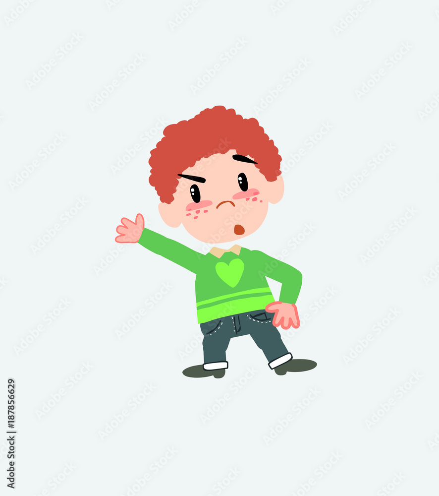 White boy in jeans something angry shows something to his right. White boy in jeans something angry shows something to his right.